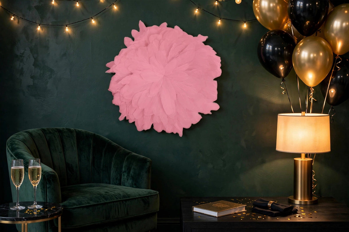 African JuJu Hats Feather Wall Art - Small - Candy Pink hung on a wall in a holiday-decorated room