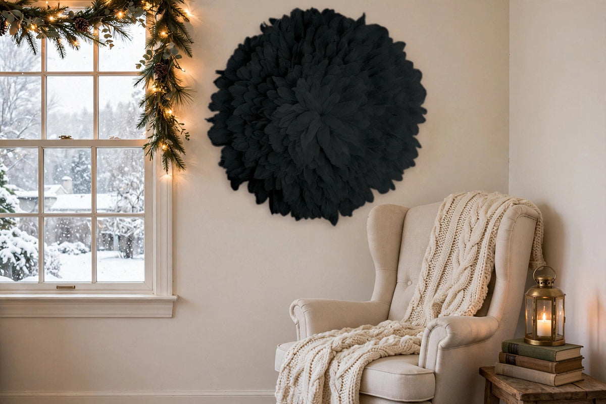 African JuJu Hat Feather Wall Art and Decor - Large - Black hung on a wall in a holiday-decorated room