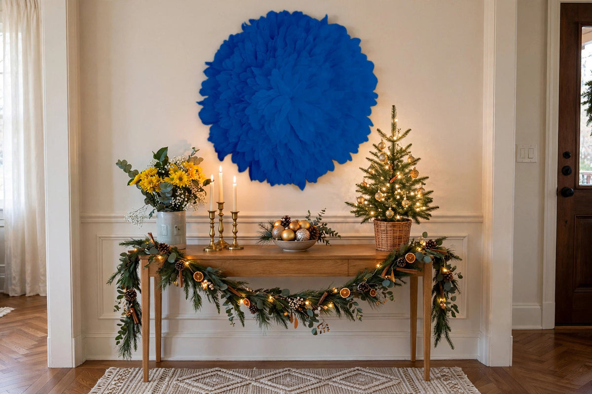 African JuJu Hat Feather Wall Art and Decor - Large - Blue Topaz hung on a wall in a holiday-decorated room