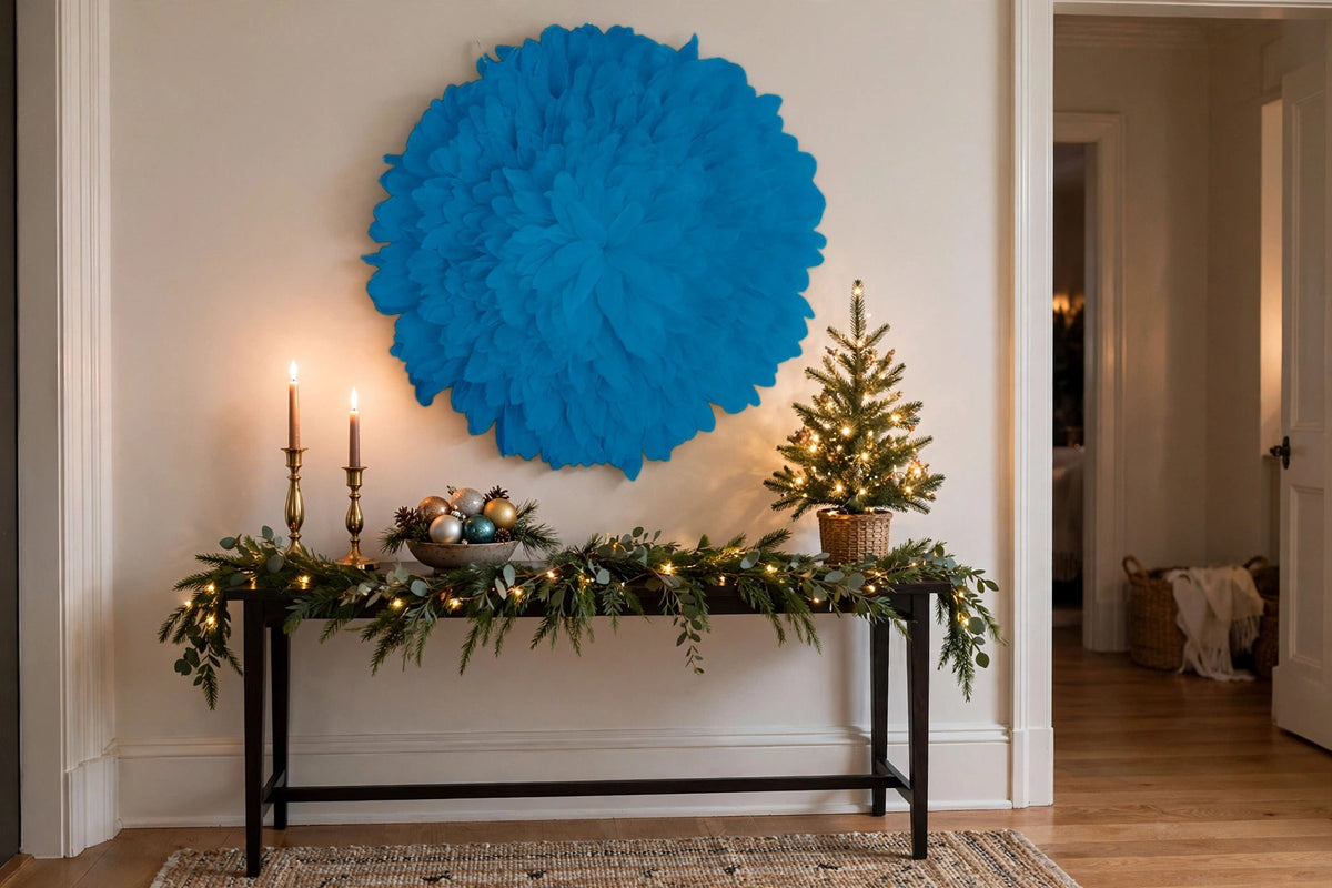 African JuJu Hat Feather Wall Art and Decor - Large - Dark Turquoise hung on a wall in a holiday-decorated room