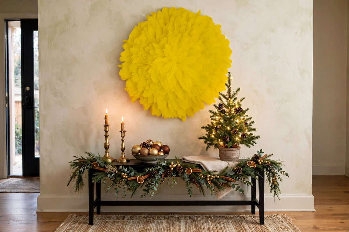 African JuJu Hat Feather Wall Art and Decor - Large - Lemon Yellow hung on a wall in a holiday-decorated room