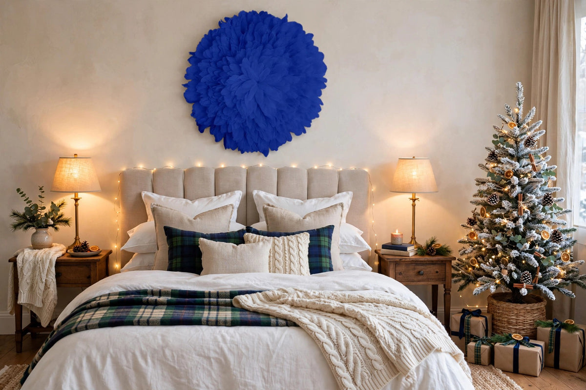 African JuJu Hat Feather Wall Art and Decor - Large - Navy hung on a wall in a holiday-decorated room