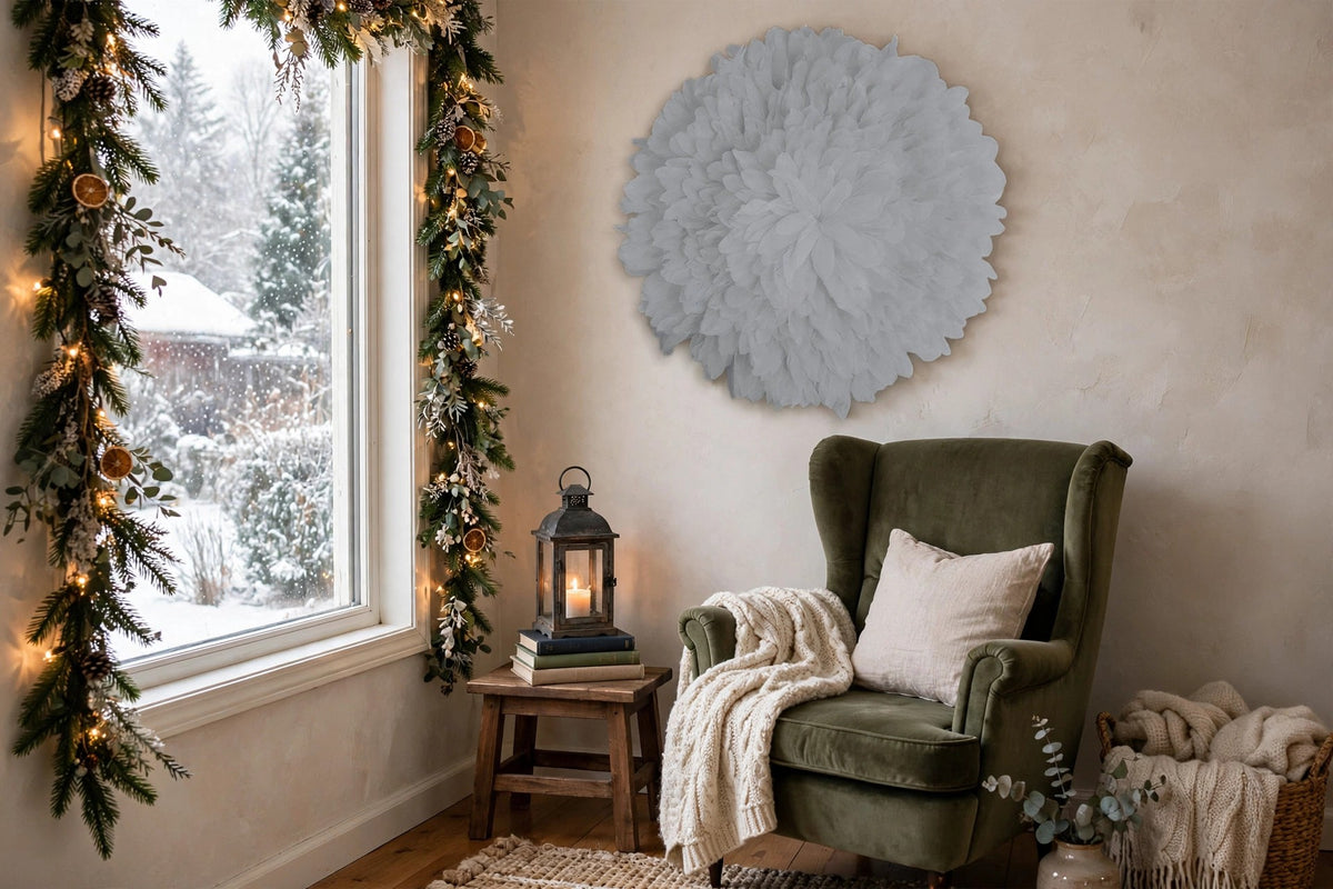 African JuJu Hat Feather Wall Art and Decor - Large - Silver hung on a wall in a holiday-decorated room