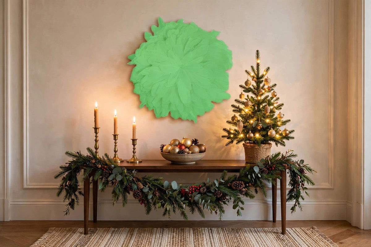 African JuJu Hats Feather Wall Art - Small - Apple hung on a wall in a holiday-decorated room