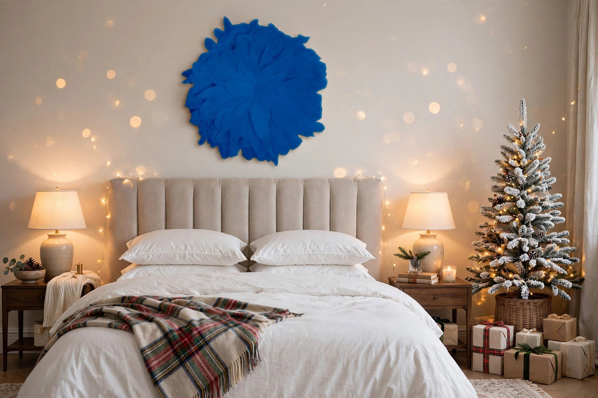 African JuJu Hats Feather Wall Art - Small - Blue Topaz hung on a wall in a holiday-decorated room