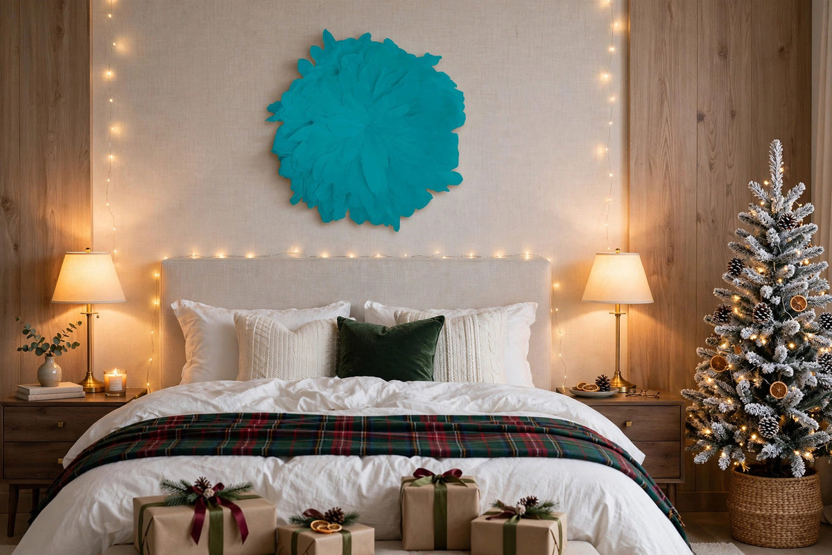 African JuJu Hats Feather Wall Art - Small - Peacock Blue hung on a wall in a holiday-decorated room