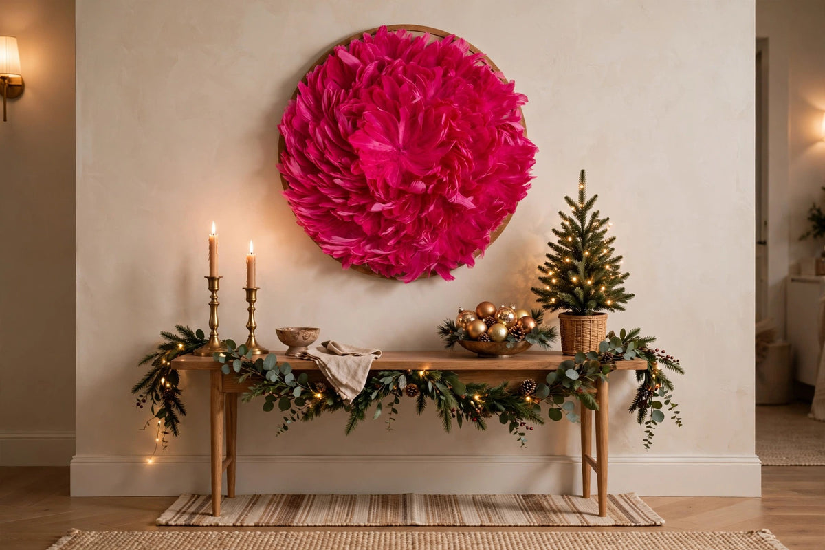 Juju Hat Nagoire Feather Wall Art 16 inch Wood Base   24-26 inch DIA --Raspberry Sorbet hung on a wall in a holiday-decorated room
