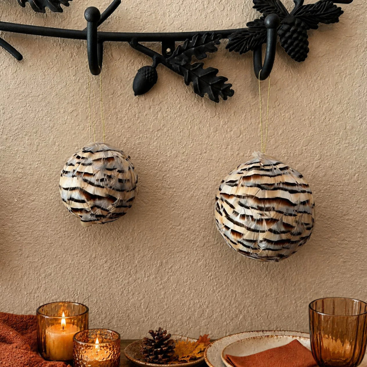 Natural partridge feather ornaments 3" and 4" hanging on a wall hook