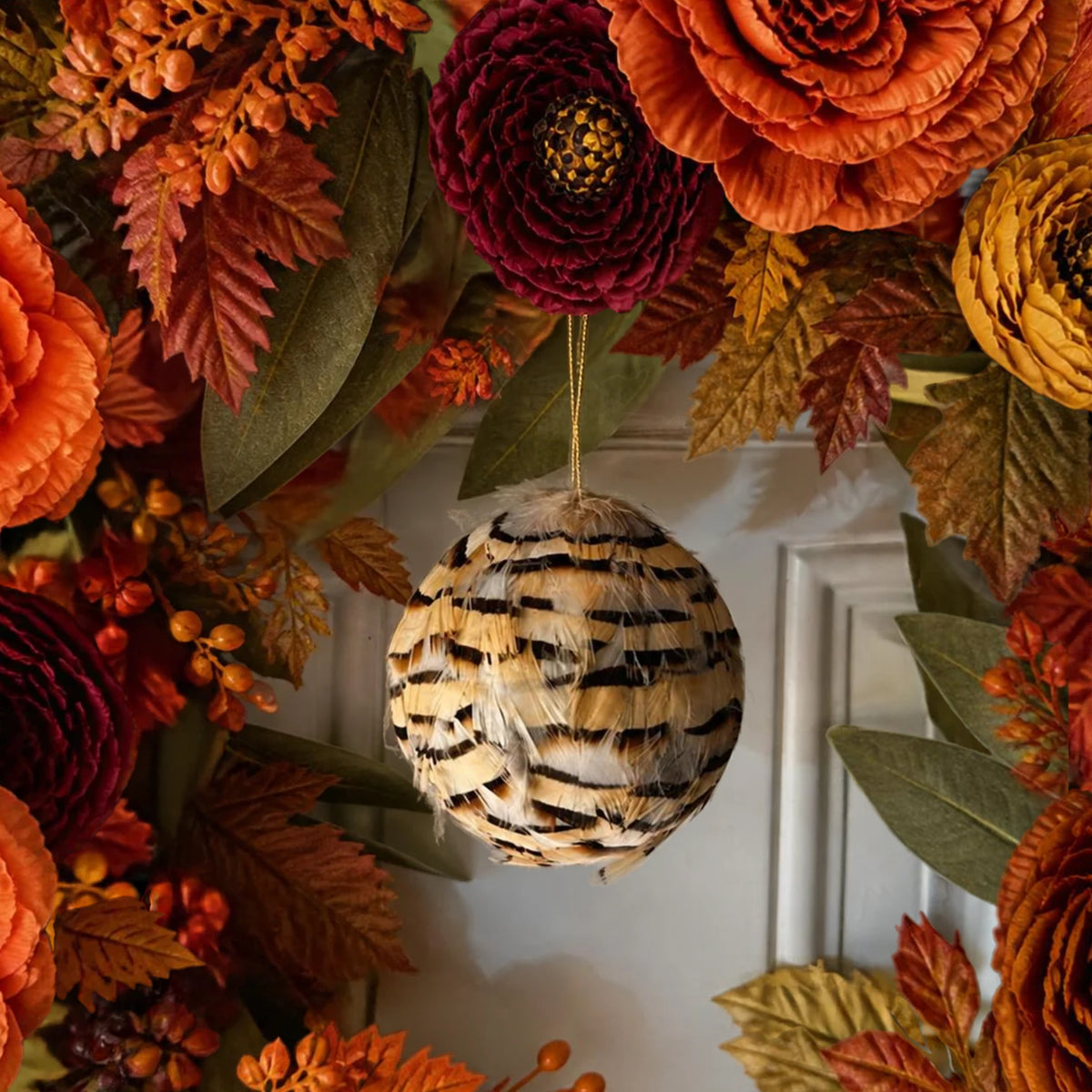 Natural partridge feather ornament 3" ball hanging on a fall wreath
