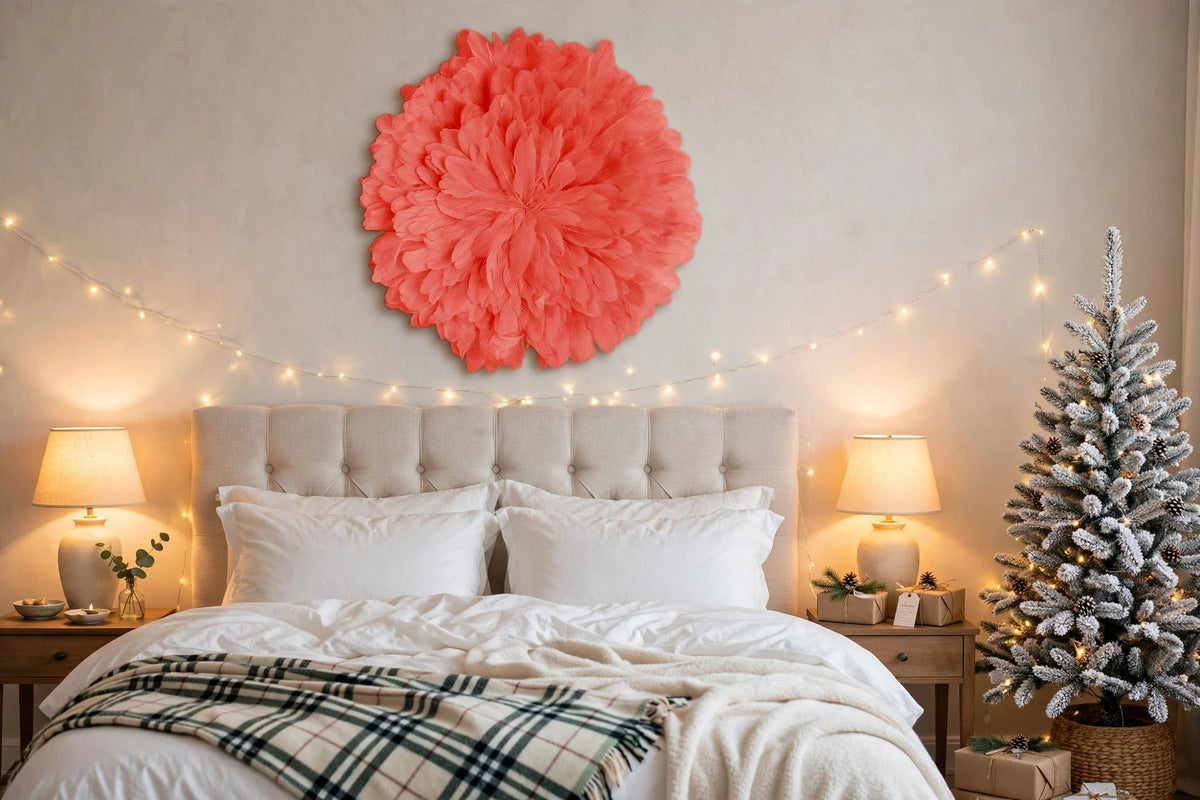Unique Decorative Feather Wall Art Inspired by African JuJu Hats - Coral hung on a wall in a holiday-decorated room